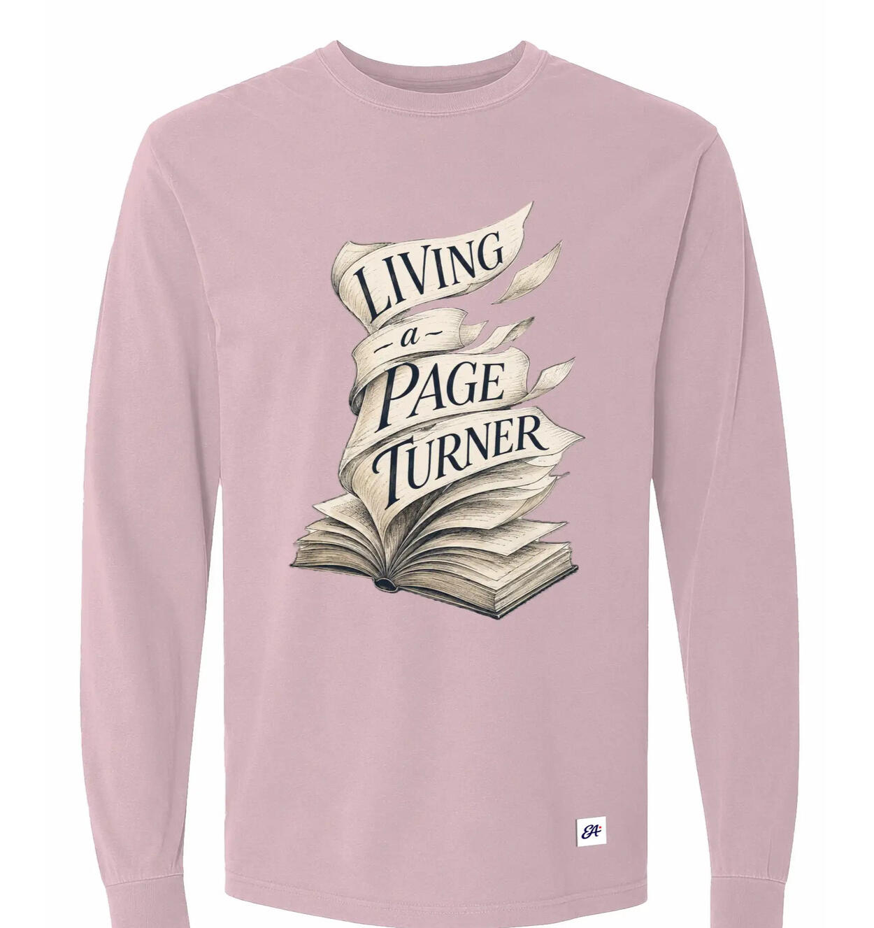 Blossom pink Living a Page Turner long-sleeve shirt with an open-book illustration and flowing page ribbons.